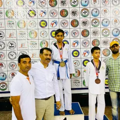 Bhanu Pratap standing tall on the podium with his gold medal from the 39th Delhi State Taekwondo Championship.