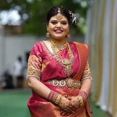 A closer look at the beautiful smile of a happy bride. The complete set, including the choker, long necklace, and maang tikka, creates a cohesive and divine bridal look.