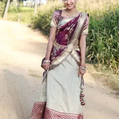 A cheerful shot of the model in the purple and cream half saree, showing the comfortable fit and beautiful flow of the skirt.