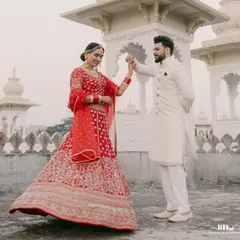 A dance of joy and new beginnings. We love seeing our grooms celebrate, and this beautiful shot captures the elegance of our classic white sherwani in motion.