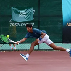 This is what high-stakes competition looks like. One of my top athletes, Tavish Pahwa, is captured here in full flight during a match at the World U14 Asia Oceania competition. My training develops the dynamic movement and technical precision required to excel on the world stage.