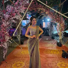 Glow in this stunning green shimmer ready-to-wear saree. The fully sequined blouse and pre-draped silhouette make it a glamorous and convenient choice for an evening reception or cocktail party.