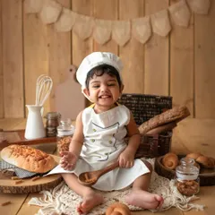 This little baker is ready to get to work! The chef theme is such a fun and interactive setup for a toddler milestone session.