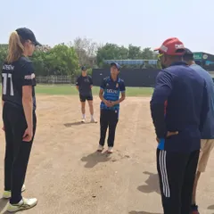 Our Women's Team during a huddle in a friendly match against the New Zealand Caps. We provide opportunities for our players to compete against international talent, which is crucial for their development.