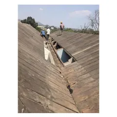 An overhead view of our team identifying and addressing decay in the original Burma Teak roof. This detailed inspection is vital for a successful historic building restoration, allowing us to replace only what is necessary.
