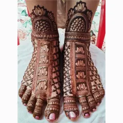 A close-up of my bridal feet mehendi work. This design features repeating lotus motifs, a symbol of purity and beauty, set within a grid pattern that covers the entire foot for a complete and elegant look.