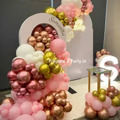 This angle highlights the layered effect of the balloon garland and the placement of the cake stand. We ensure every component is perfectly positioned for a balanced and photogenic result.