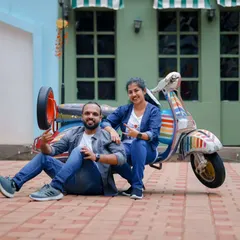 A fun and quirky pre-wedding photo with a colorful scooter. Props like these are a great way to show your playful side as a couple.