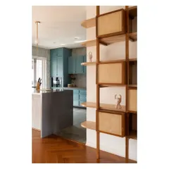 This modular shelving unit in the 'House of Skye' was designed with teak posts and birch ply shelves. The boxes can be rearranged, allowing the clients to adapt the display as they collect new objects and memorabilia.