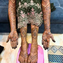 The complete picture of a full bridal mehendi session. This shows the extensive coverage I provide, ensuring you look like a queen on your wedding day.