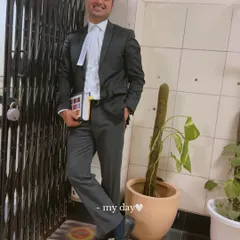 A candid shot of my day. Dressed in my uniform, holding my law books, I am always ready for the challenges of the legal world.