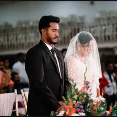 A solemn moment of prayer for the couple at the altar, captured respectfully to preserve the sanctity of the ceremony.