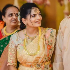 A beautiful makeover for the new mom, Pooja, at her child's naming ceremony. The look is minimal and fresh, perfect for a daytime family event.