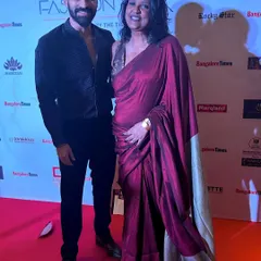 On the red carpet with a friend. He looks sharp in this all-black look. I am now designing modern and traditional wear for men for all occasions.