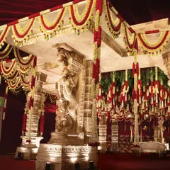 Here you can see the majestic lion pillars, a direct inspiration from Hampi's iconic structures. These motifs symbolize strength and protection, adding a regal and deeply symbolic touch to the sacred rituals.