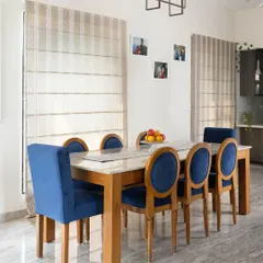 A duplicate of ID 43, highlighting the clean, modern aesthetic of the dining room, where classic materials meet a contemporary color choice.