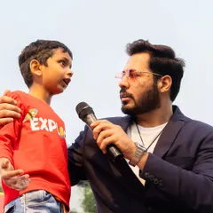 Hosting isn't just for big crowds. Some of the best moments come from connecting one on one, like at this kids' carnival. Making even the youngest guests feel seen and heard is what it's all about.