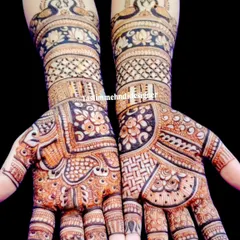 This design combines beautiful peacock and lotus motifs at the wrist with intricate geometric and floral patterns covering the entire palm. The contrast between bold and fine lines makes the design stand out.
