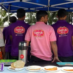 A shot of our team from the back, showing off our Sethji's Kitchen branded t-shirts. We are a team, united in our mission to serve delicious food.