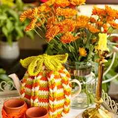 I love adding a little desi touch to my creations. This tea cozy set, with its bright saffron, white, and green stripes and matching kulhad covers, is my nod to Independence Day, perfect for a festive morning chai.