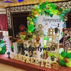 Another view of the jungle safari stage, showing the arrangement of animal cutouts like the zebra and lion, and the themed pedestals.