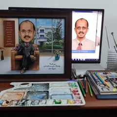 Here is the final framed caricature for the boss, shown next to the original photo, ready to be gifted. Our workspace shows the tools we use for our handmade art.