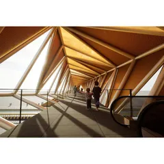 The interior of the footbridge reveals its complex geometric structure. The play of light and shadow through the triangulated frame creates a memorable experience for pedestrians.