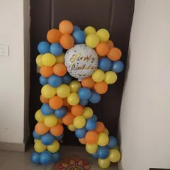 A custom balloon arrangement in the shape of the letter 'R'. This is a great way to personalize any party decoration.