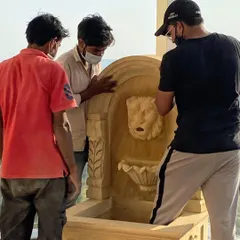 Our skilled team carefully positions the heavy stone water feature on the terrace. This hands-on process ensures every element is installed perfectly, bringing our detailed design plans to life.