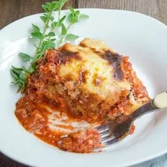 Nothing says comfort like my freshly baked Moussaka. It's made with layers of seasoned ground beef and tender eggplant, all baked under a rich and cheesy Mornay sauce.