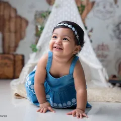 A happy crawler exploring the studio. This shot is from a sitter session, perfect for babies around 6 to 9 months who are on the move and full of curiosity.