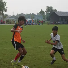 A one on one duel from the U16 RSA Cup. Our player uses his body to shield the ball while looking to drive past the defender.