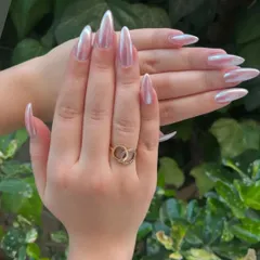 A stunning example of the popular chrome nail trend. I used a high-quality chrome powder over long stiletto extensions to create this liquid-metal, pearlescent effect that shifts beautifully in the light. This look is modern, chic, and incredibly eye-catching.