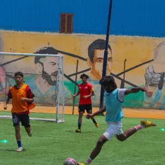 A player demonstrates excellent form while taking a powerful shot on goal. This image captures the culmination of countless hours of practice, focusing on technique, balance, and power. Our shooting drills are designed to turn players into confident and clinical finishers.
