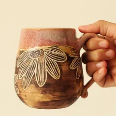 The comfortable, handcrafted handle and rounded shape make this Pink Sienna mug a joy to hold. It feels substantial and personal, a true companion for your favorite brew.