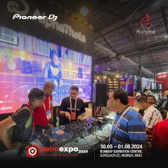 Demonstrating a vinyl setup at the Palm Expo. It's important to understand the roots of DJing, even as we embrace new digital tools.
