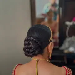 The side profile of the twisted bun, highlighting the volume and structure.