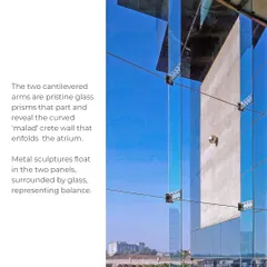 The facade of the UTI HQ features two cantilevered glass prisms that part to reveal a curved 'malad' crete wall. This interplay of materials and forms creates a dynamic tension, symbolizing an organization that is both solid and transparent.