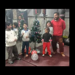 Posing with the kids by the Christmas tree. These moments of fun and celebration strengthen the bonds within our dojo.