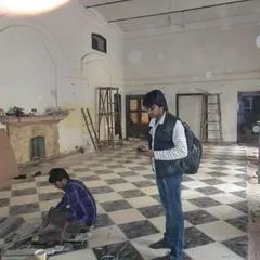 My team documenting and planning the floor restoration on-site, a critical step in ensuring the geometric accuracy of the marble inlay.