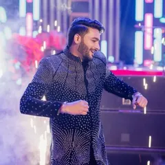 The groom looking sharp and confident during his sangeet performance. I help grooms feel comfortable on stage so they can enjoy their moment.