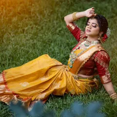 A Muhurtham look we created for a student demonstration. This yellow silk saree is paired with a contrasting red puff-sleeve blouse, adorned with traditional embroidery.
