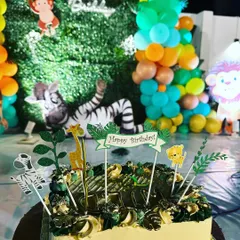 A custom jungle themed birthday cake, complete with edible animal toppers. The cake is often the star of the show at a kid's party, and we make sure it looks and tastes amazing.
