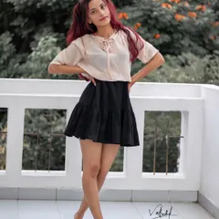 A full-length casual portrait from our balcony shoot. The model's confident stance and simple, stylish outfit are perfect for capturing a relaxed, everyday fashion look.