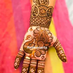 A single, elegant peacock design on the palm. This style is perfect for someone who wants a touch of traditional art without a full-hand design.