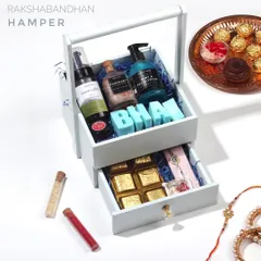 This premium Rakhi hamper for your 'Bhai' comes in a unique wooden basket with a drawer. It's filled with organic skincare, handmade chocolates, and a beautiful rakhi.