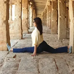 Flexibility is a journey, not a destination. Here I am practicing Hanumanasana (the splits) in a beautiful, historic corridor. Yoga can be practiced anywhere, reminding us to find focus amidst distraction.