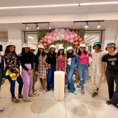 The whole party crew showing off their hand-painted bucket hats. This birthday celebration was all about wearable art, and these girls absolutely rocked their unique designs.