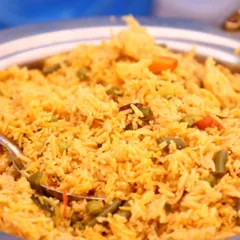 Fragrant and colorful vegetable pulao, cooked with long-grain basmati rice and fresh vegetables, a popular main course for all events.