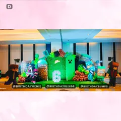 Another large-scale Minecraft party, this time for a 6th birthday. The setup features a mossy block backdrop, character standees, and themed balloon colors.